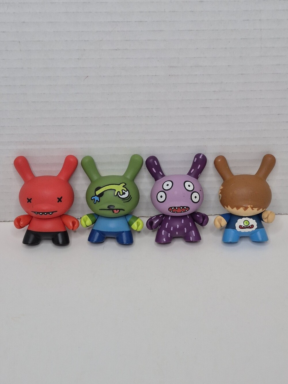 Kidrobot Two Faced Dunnys Lot of Four Shown Pre Owned Collectible